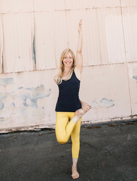 portrait of Jody Hahn in a standing yoga pose
